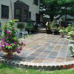 Multi-Color Slate Patio with a Paver Wall